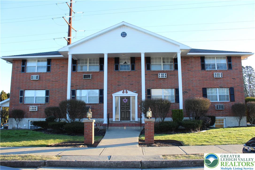 1204 Lewis Street, Unit BE Bethlehem, PA 18017 - Photo 1 of 13 a front view of a house with garden