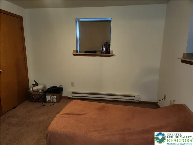 a bedroom with a bed and furniture