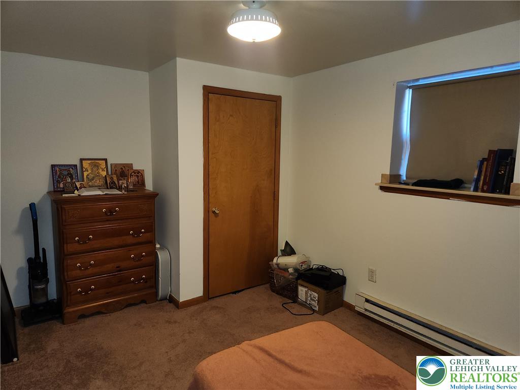 1204 Lewis Street, Unit BE Bethlehem, PA 18017 - Photo 12 of 13 a bedroom with a bed and furniture