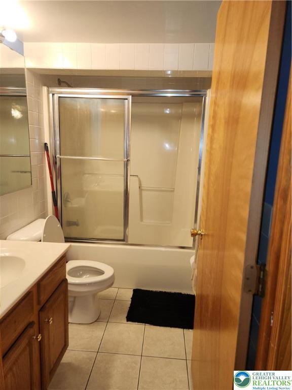 1204 Lewis Street, Unit BE Bethlehem, PA 18017 - Photo 13 of 13 a bathroom with a granite countertop sink toilet and shower