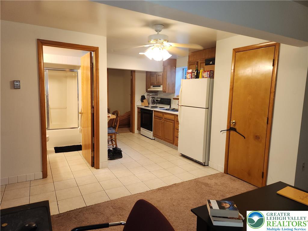 1204 Lewis Street, Unit BE Bethlehem, PA 18017 - Photo 7 of 13 a kitchen with stainless steel appliances granite countertop a refrigerator a stove and a sink