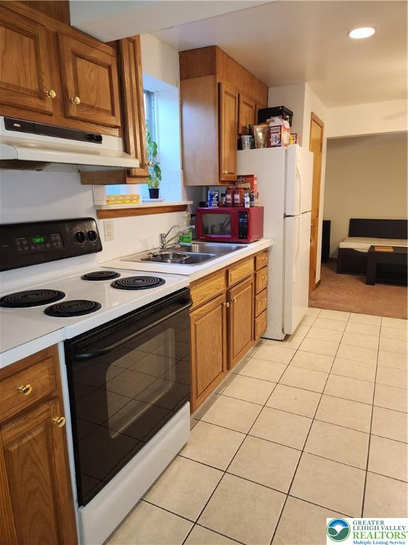 1204 Lewis Street, Unit BE Bethlehem, PA 18017 - Photo 8 of 13 a kitchen with stainless steel appliances granite countertop a stove a refrigerator and a cabinets