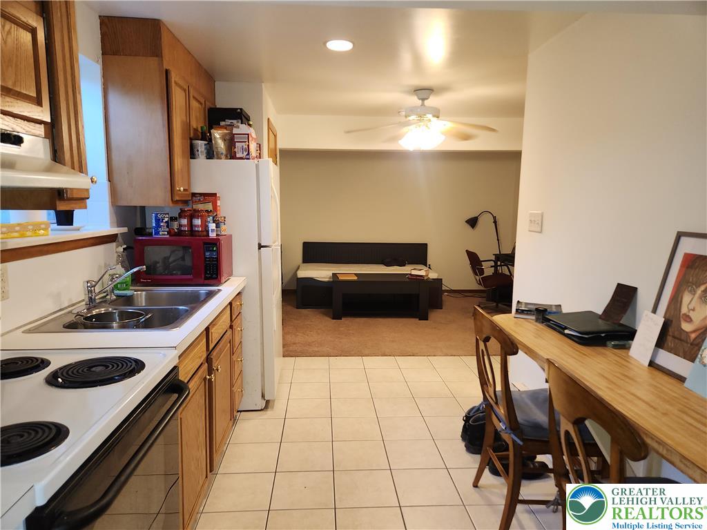 1204 Lewis Street, Unit BE Bethlehem, PA 18017 - Photo 10 of 13 a kitchen with a sink appliances and cabinets