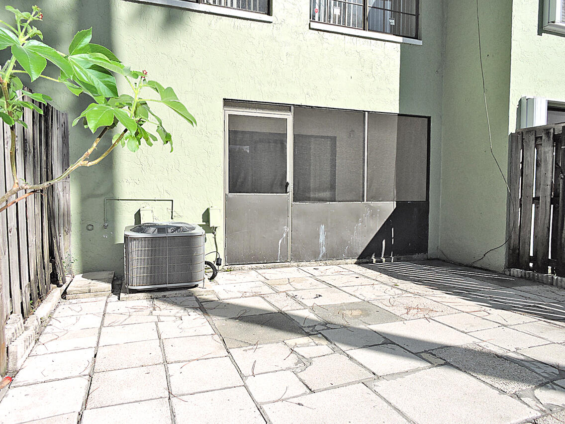 5040 Society Place East, Unit E West Palm Beach, FL 33415 - Photo 13 of 26 a view of a backyard of a house