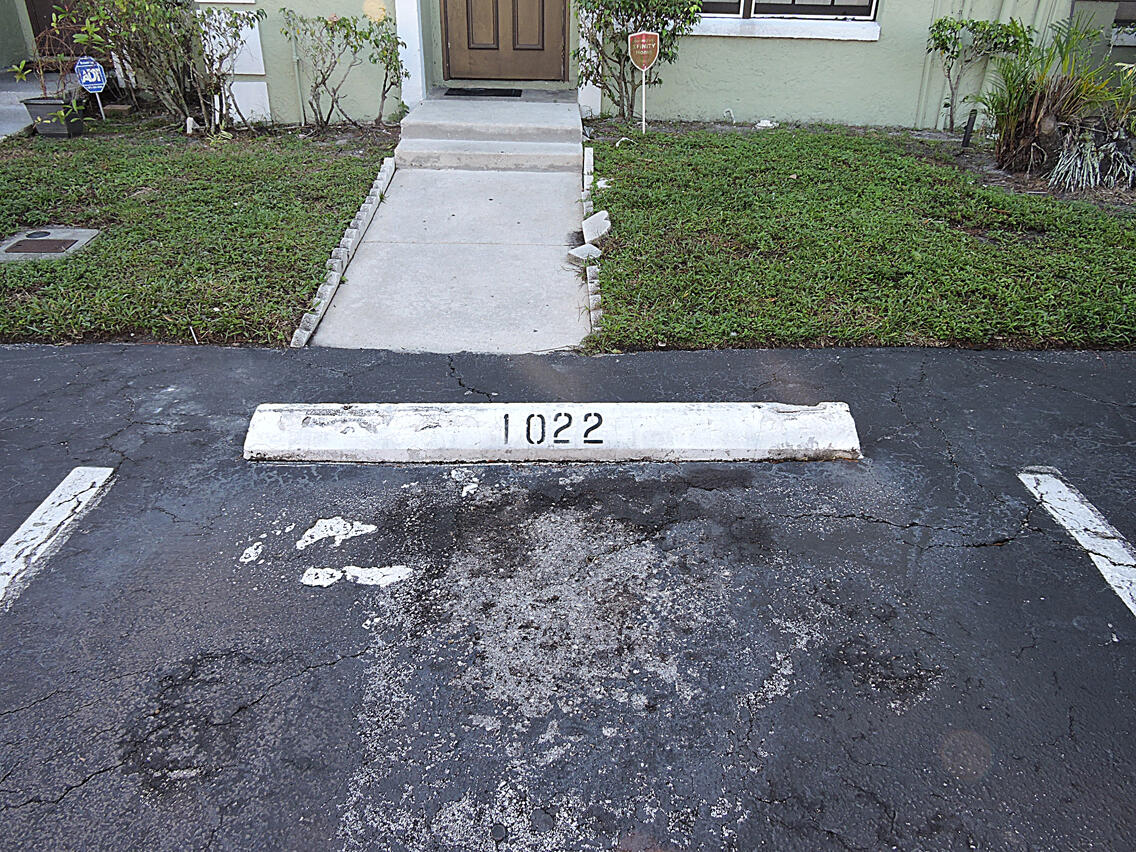 5040 Society Place East, Unit E West Palm Beach, FL 33415 - Photo 26 of 26 a view of a house with a yard