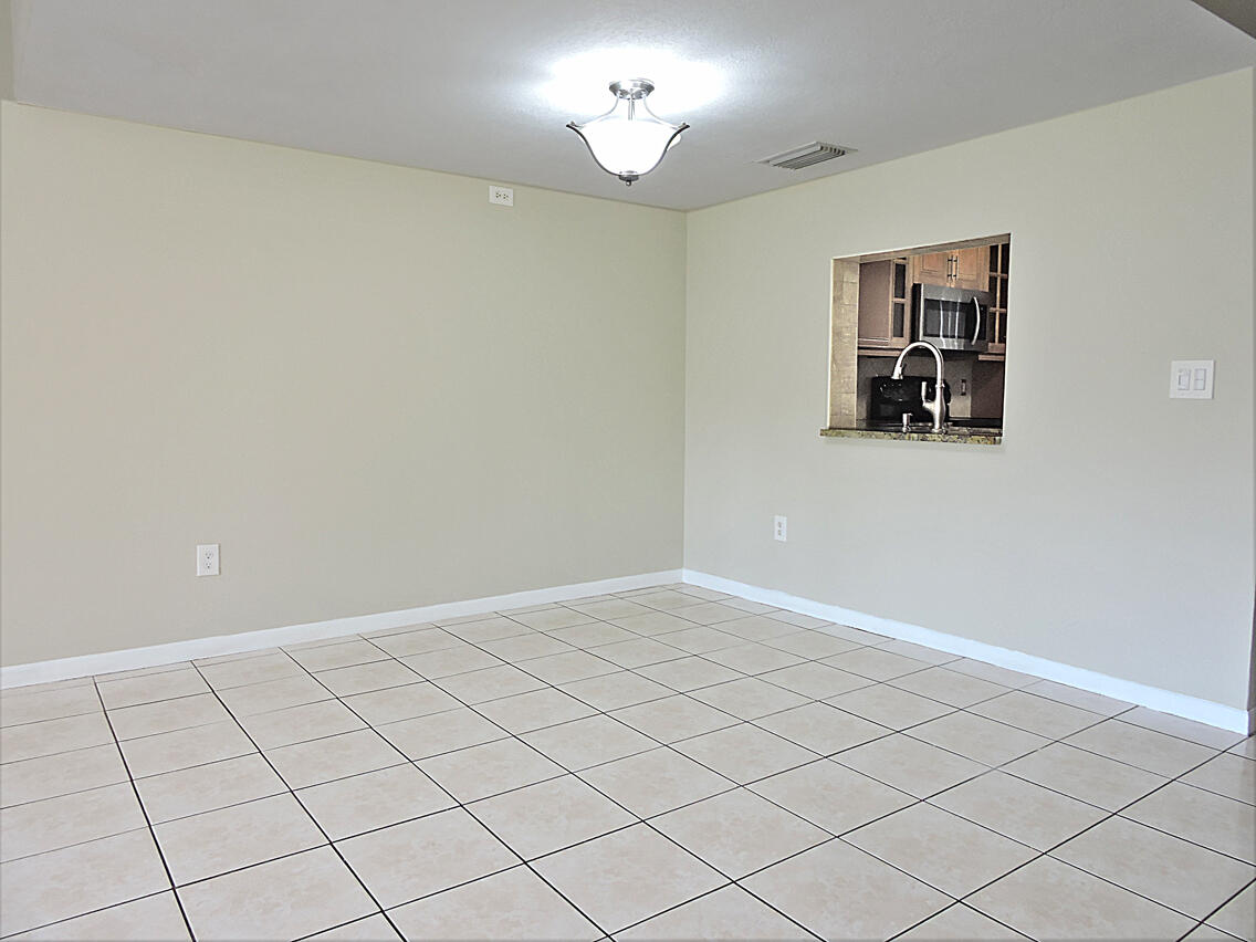 5040 Society Place East, Unit E West Palm Beach, FL 33415 - Photo 5 of 26 a view of an empty room