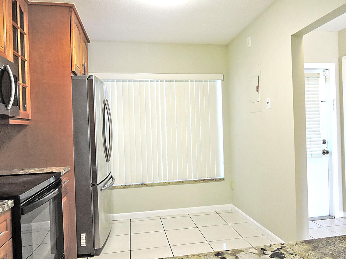 5040 Society Place East, Unit E West Palm Beach, FL 33415 - Photo 7 of 26 a view of an empty room with a window