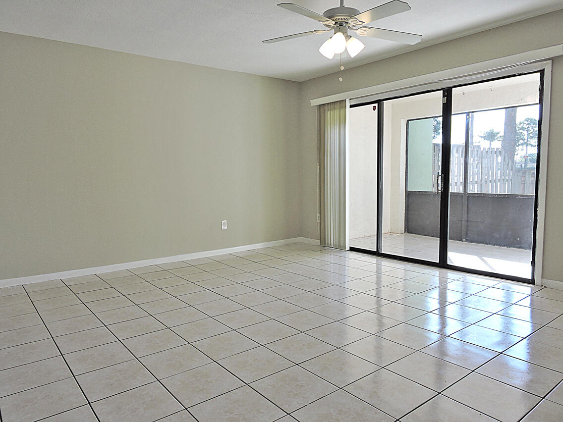 5040 Society Place East, Unit E West Palm Beach, FL 33415 - Photo 9 of 26 a view of an empty room with a window