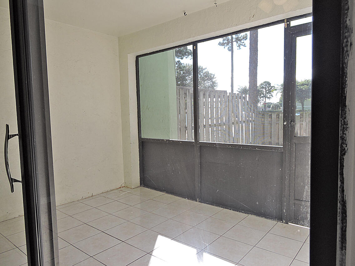5040 Society Place East, Unit E West Palm Beach, FL 33415 - Photo 10 of 26 a view of a glass entrance door