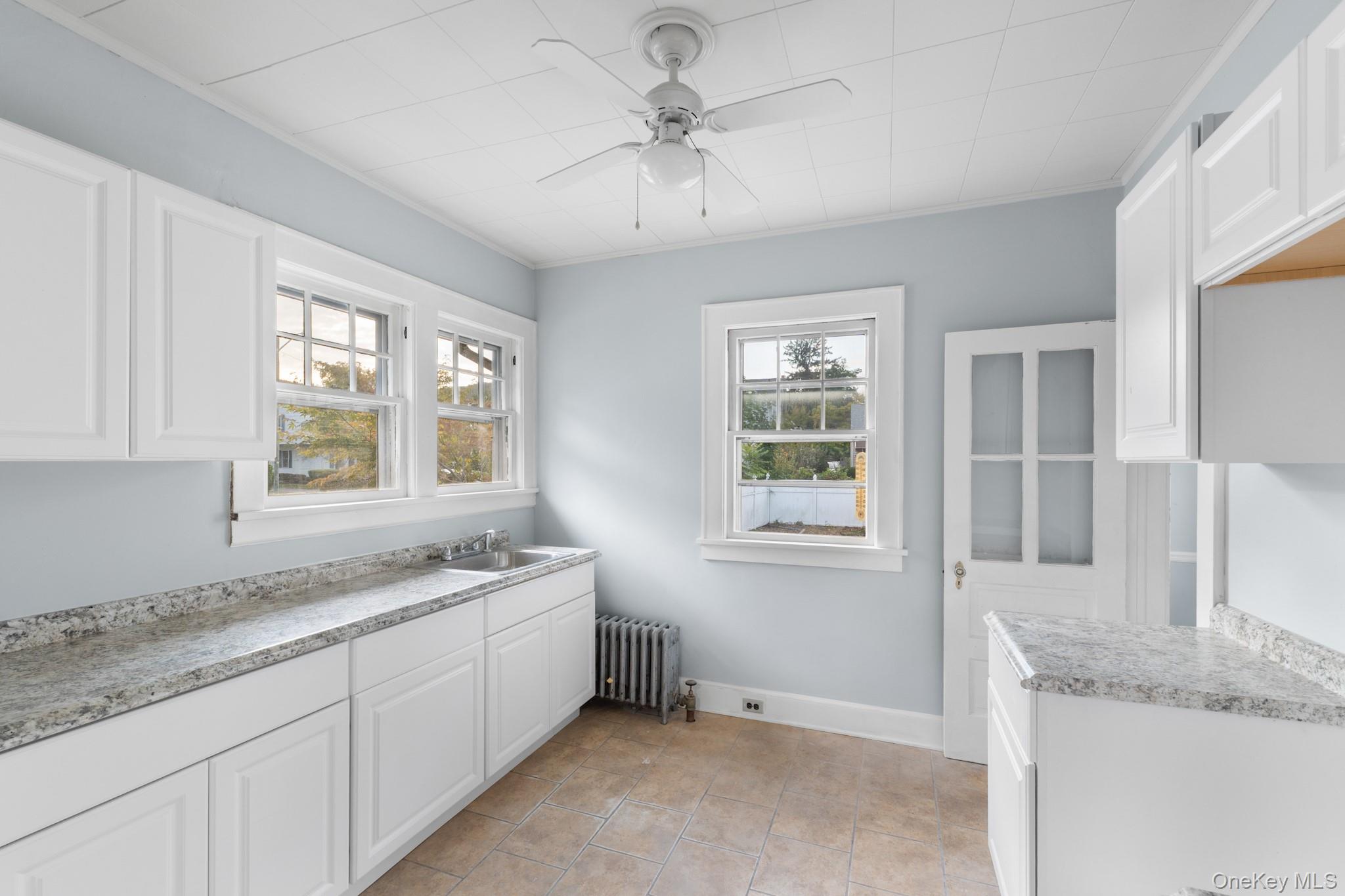 16 Oak Terrace Suffern, NY 10901 - Photo 11 of 26 a bathroom with a granite countertop sink mirror and window