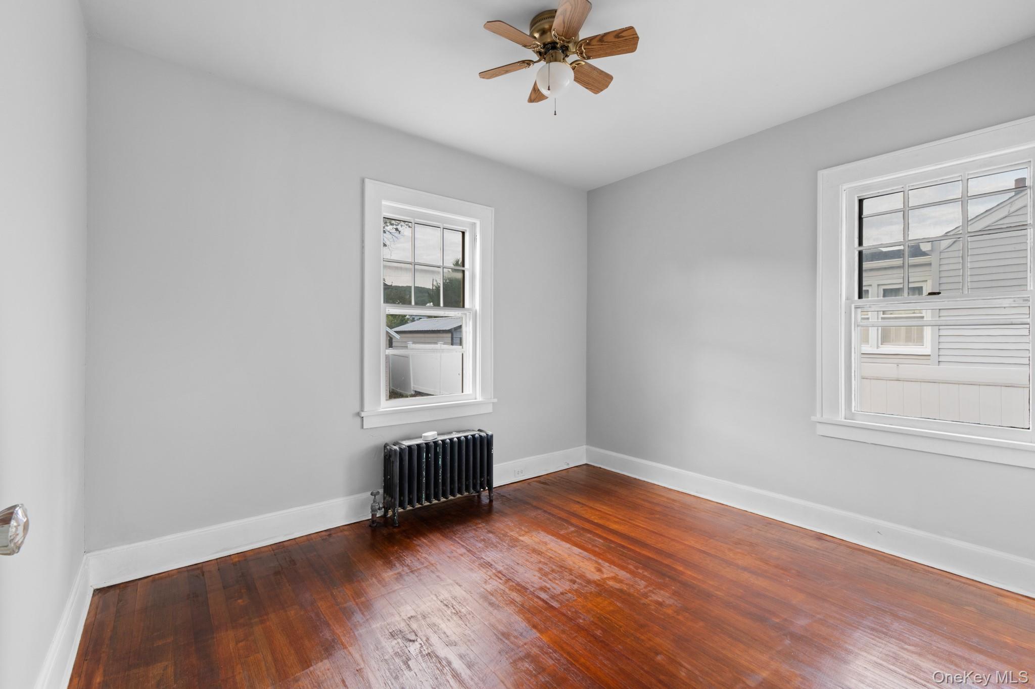 16 Oak Terrace Suffern, NY 10901 - Photo 14 of 26 a view of empty room with wooden floor and fan