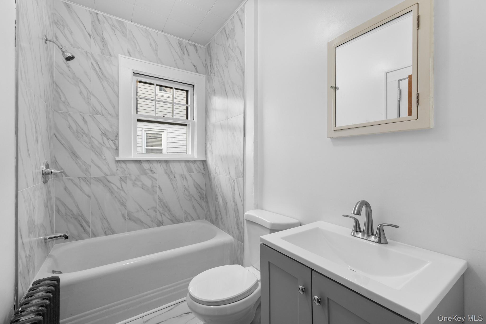 16 Oak Terrace Suffern, NY 10901 - Photo 16 of 26 a bathroom with a sink toilet and bathtub
