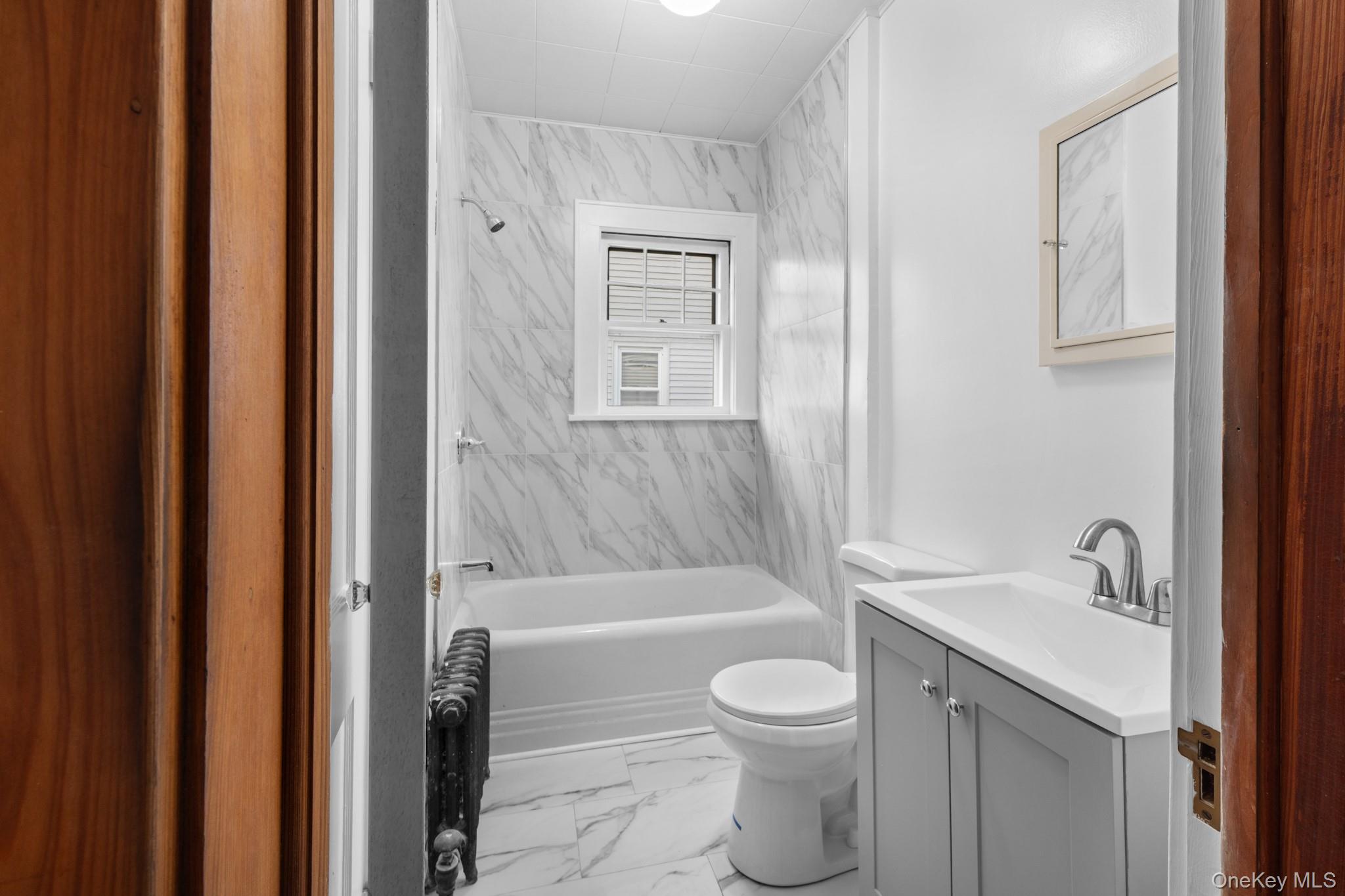 16 Oak Terrace Suffern, NY 10901 - Photo 17 of 26 a bathroom with a toilet a sink and bathtub