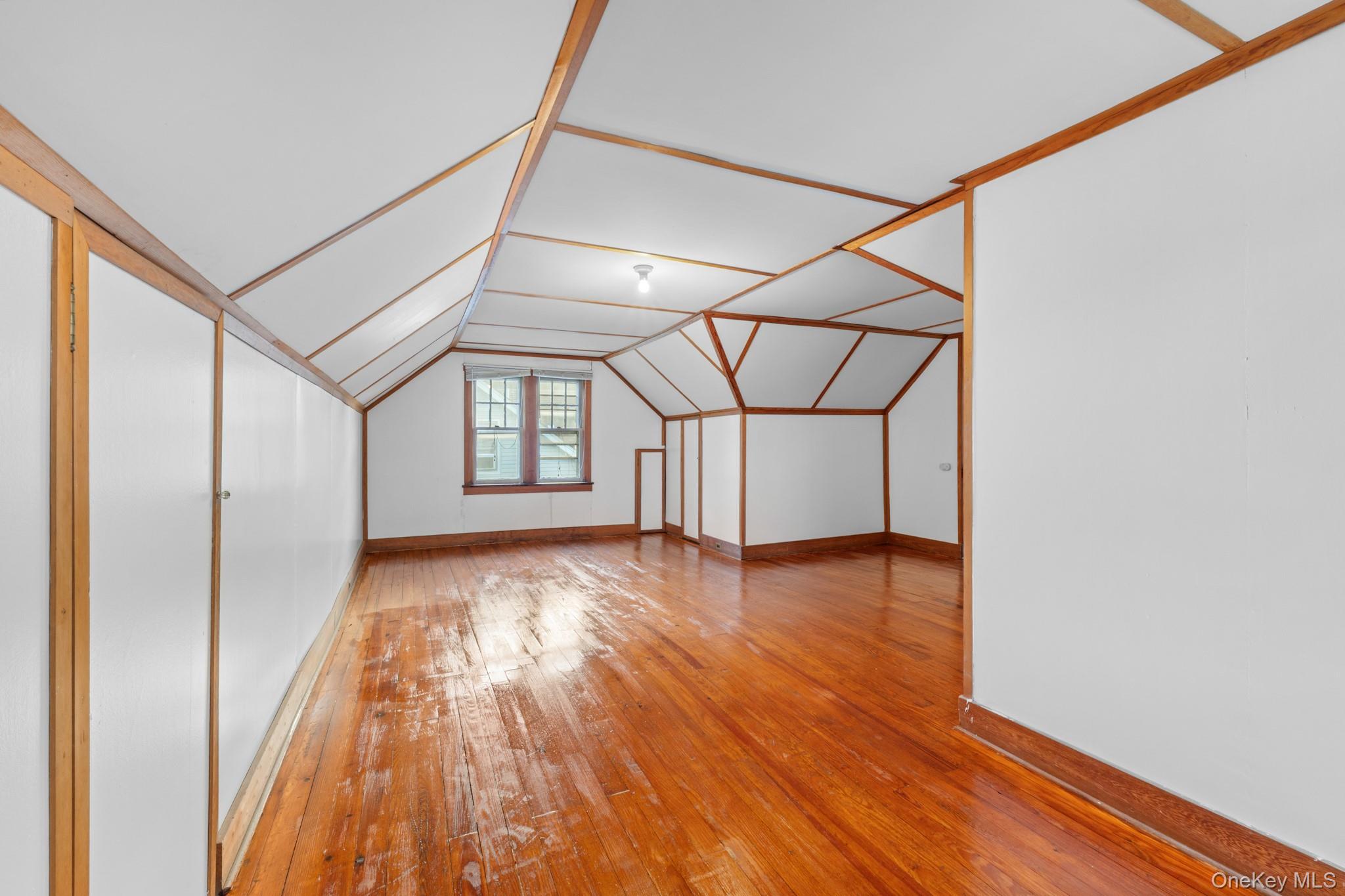 16 Oak Terrace Suffern, NY 10901 - Photo 21 of 26 a view of an empty room with wooden floor and a window