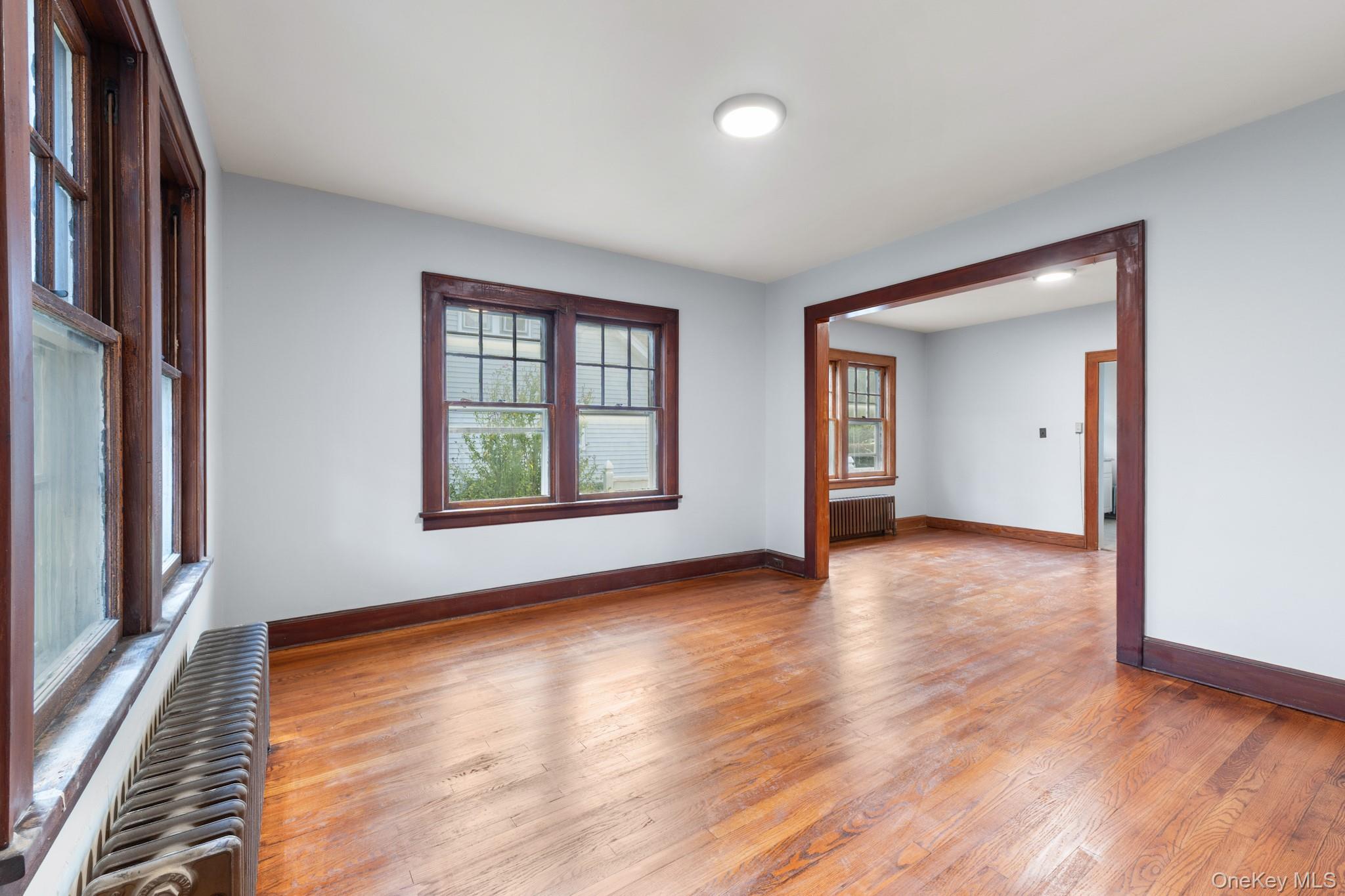 16 Oak Terrace Suffern, NY 10901 - Photo 6 of 26 a view of an empty room with window and wooden floor