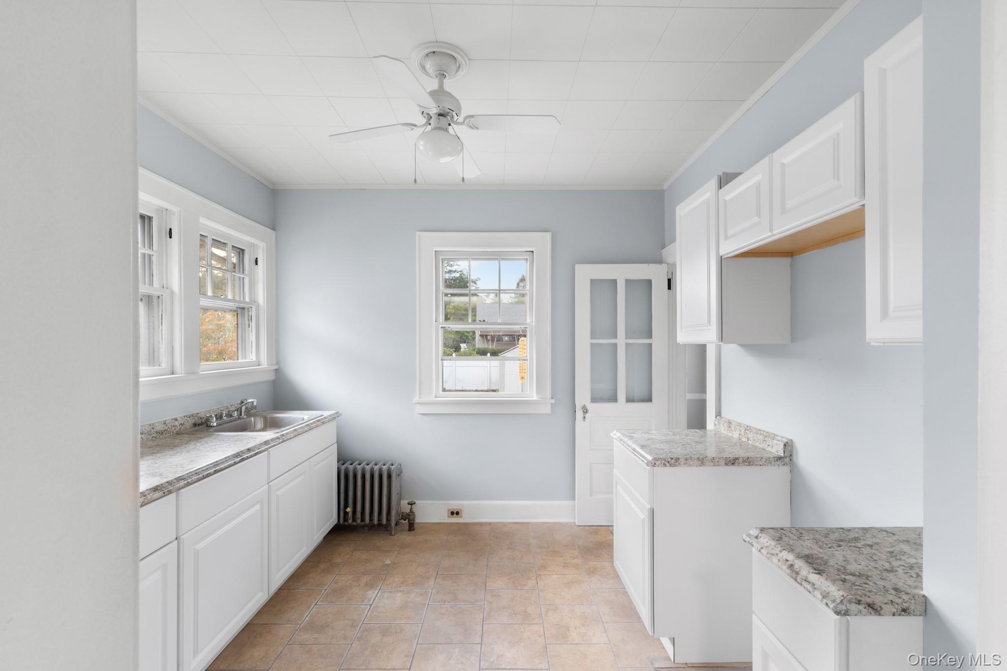 16 Oak Terrace Suffern, NY 10901 - Photo 10 of 26 a kitchen with a sink stove and cabinets