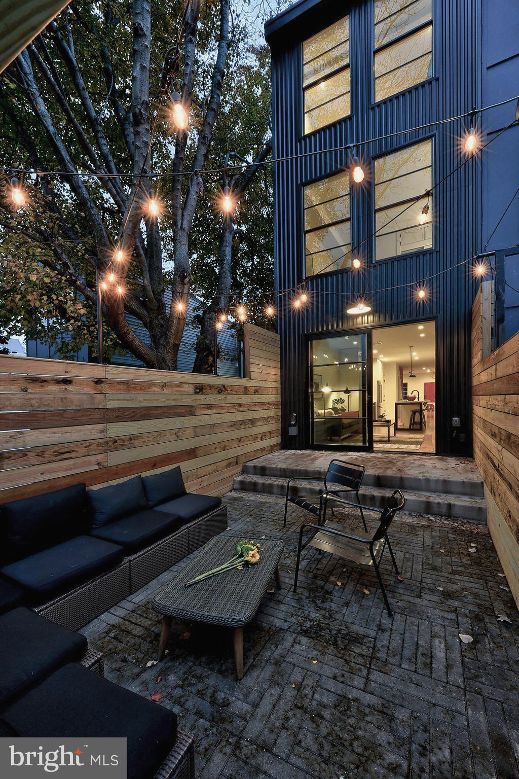 443 Ridge Street Northwest Washington, DC 20001 - Photo 2 of 47 a view of a yard with chairs in a patio