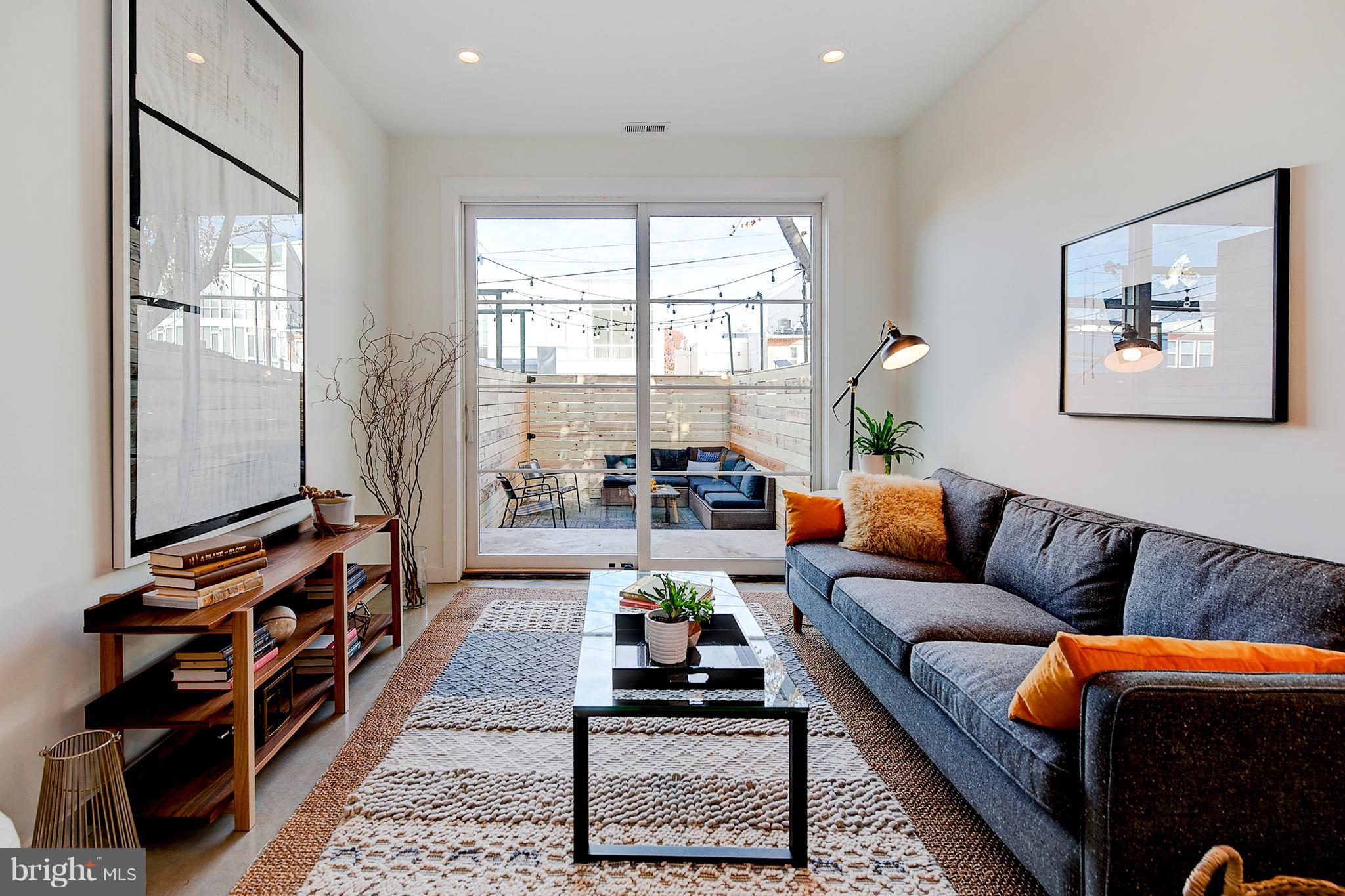 443 Ridge Street Northwest Washington, DC 20001 - Photo 16 of 47 a living room with furniture and a flat screen tv