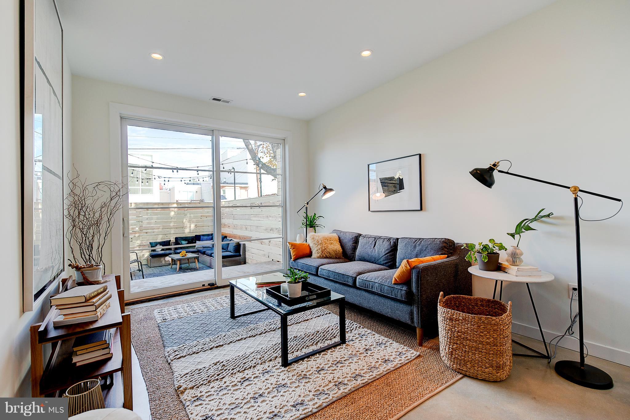 443 Ridge Street Northwest Washington, DC 20001 - Photo 17 of 47 a living room with furniture and wooden floor