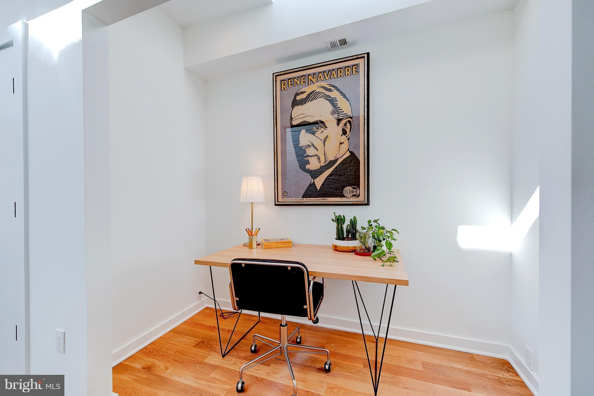 443 Ridge Street Northwest Washington, DC 20001 - Photo 24 of 47 a room with table and chairs