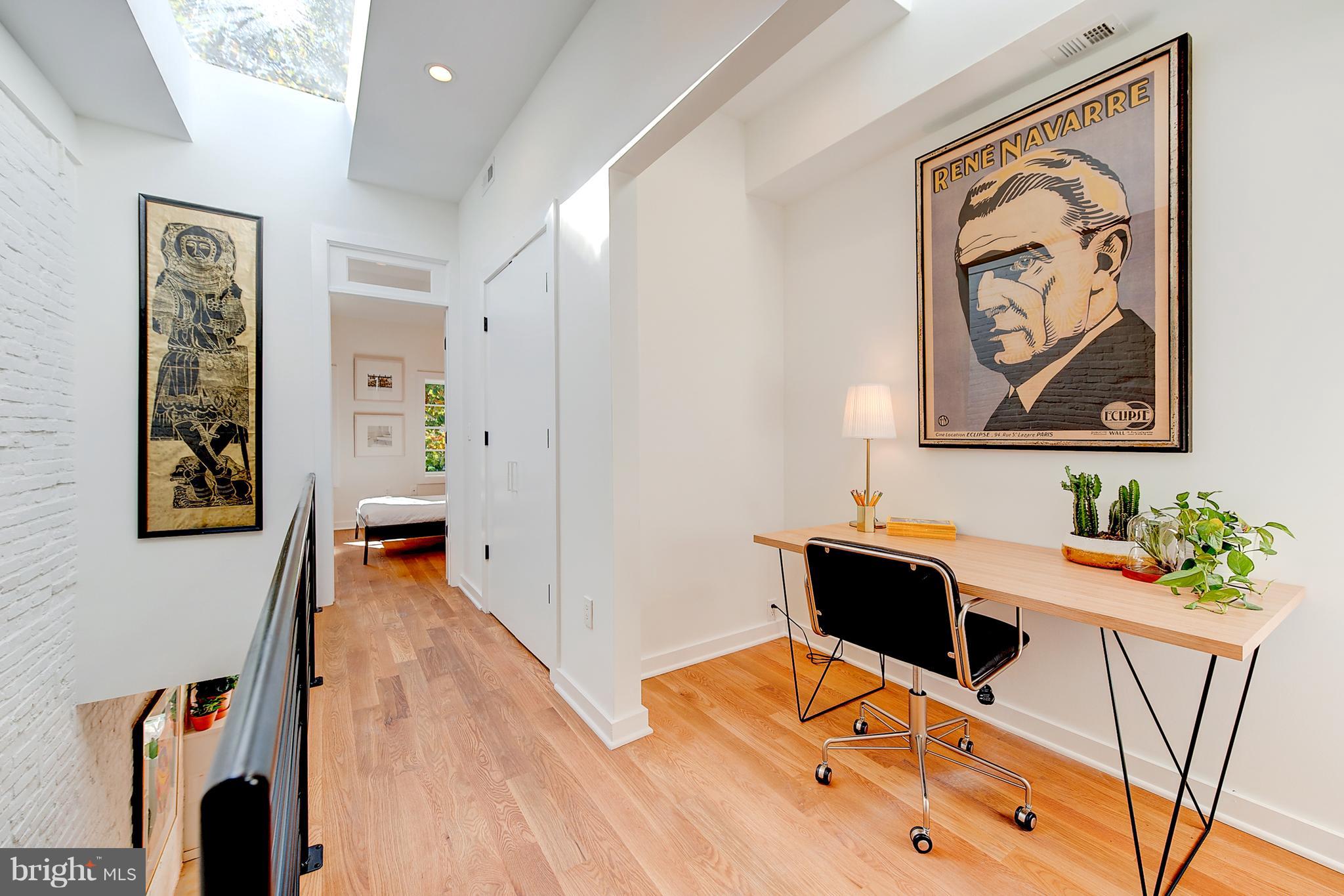 443 Ridge Street Northwest Washington, DC 20001 - Photo 29 of 47 a view of a workspace with furniture and wooden floor