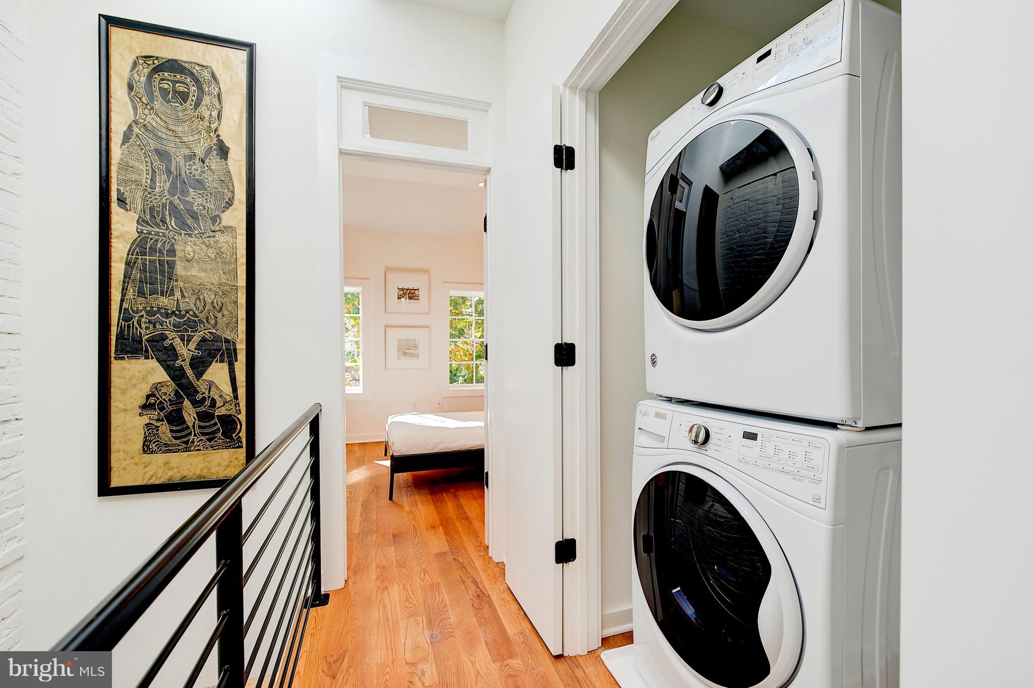 443 Ridge Street Northwest Washington, DC 20001 - Photo 30 of 47 a view of a hallway with washer and dryer