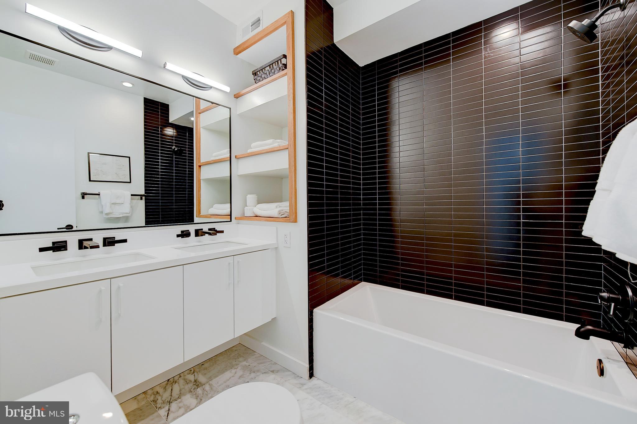 443 Ridge Street Northwest Washington, DC 20001 - Photo 32 of 47 a bathroom with a bathtub and a sink