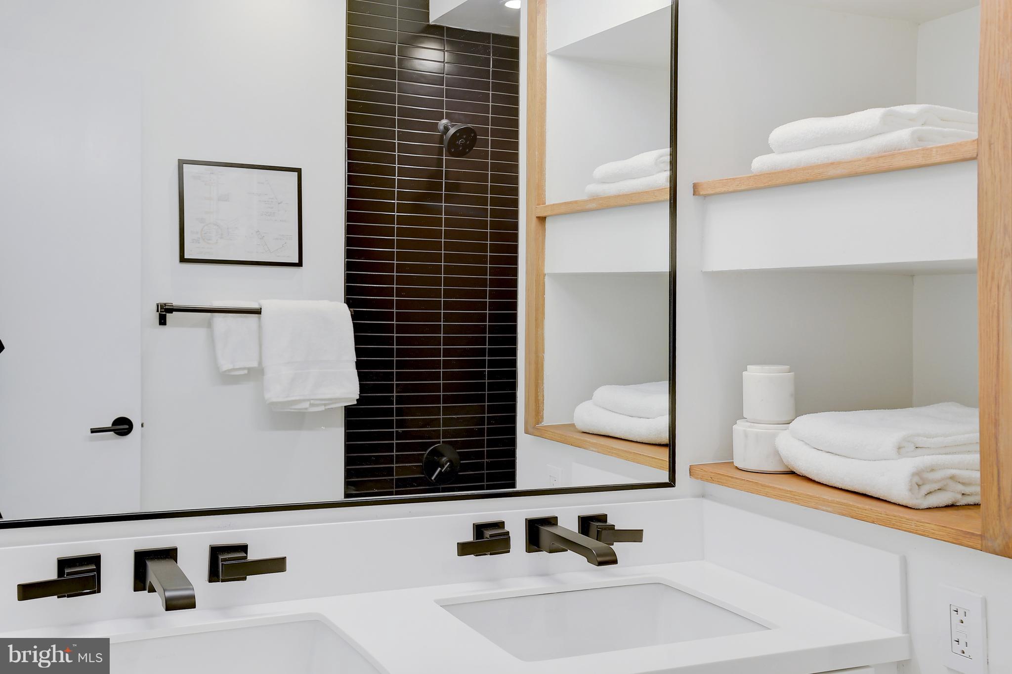 443 Ridge Street Northwest Washington, DC 20001 - Photo 33 of 47 a bathroom with a sink and a mirror