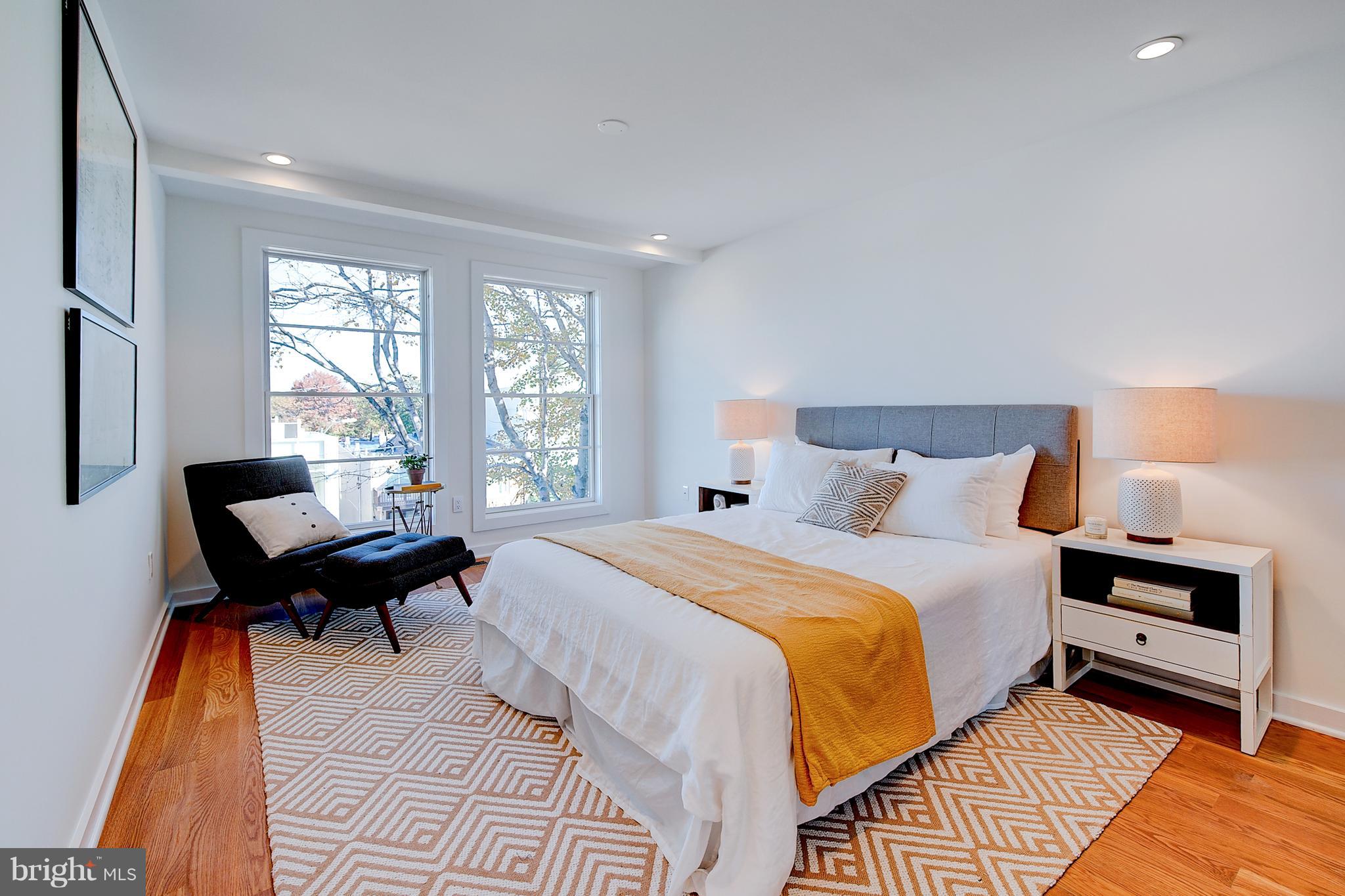 443 Ridge Street Northwest Washington, DC 20001 - Photo 36 of 47 a bedroom with a bed and a window