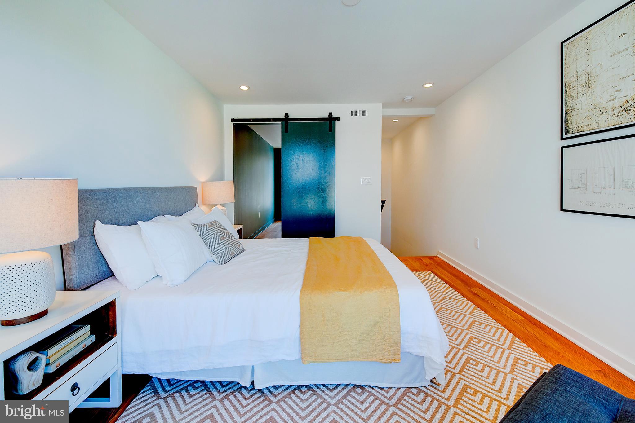 443 Ridge Street Northwest Washington, DC 20001 - Photo 37 of 47 a bed room with a bed