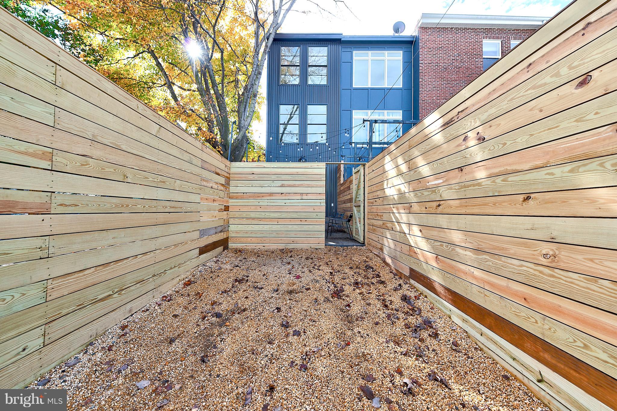 443 Ridge Street Northwest Washington, DC 20001 - Photo 43 of 47 a view of a house with a yard