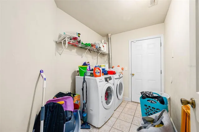 a utility room with toys and washer