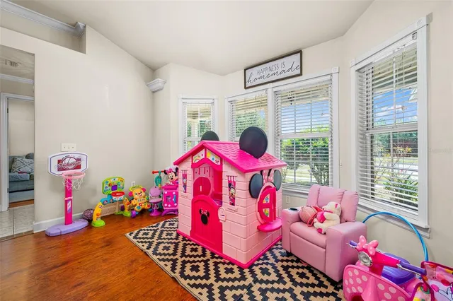 a bedroom with furniture and a window