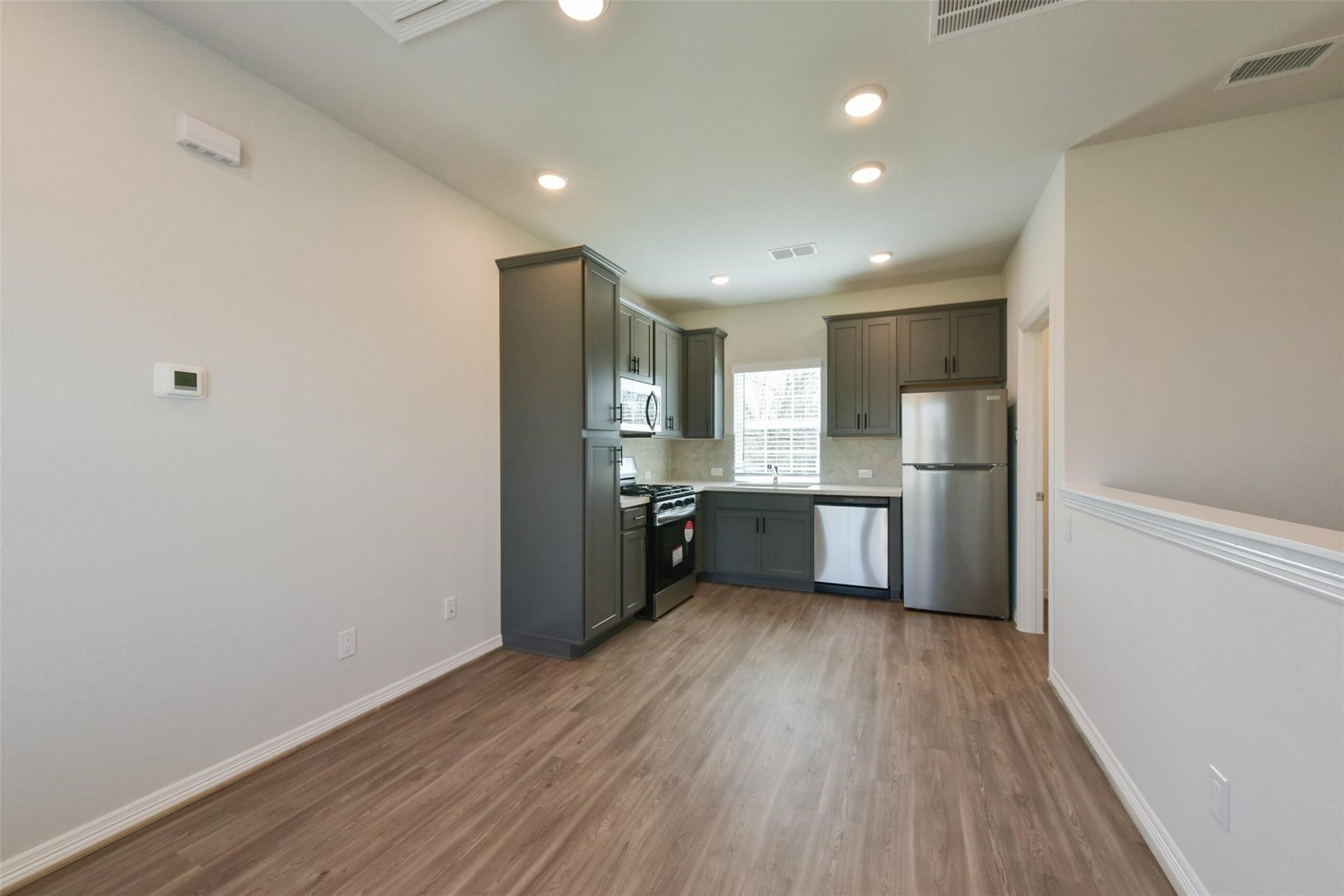 6835 New York Street Houston, TX 77021 - Photo 4 of 12 a view of kitchen with wooden floor
