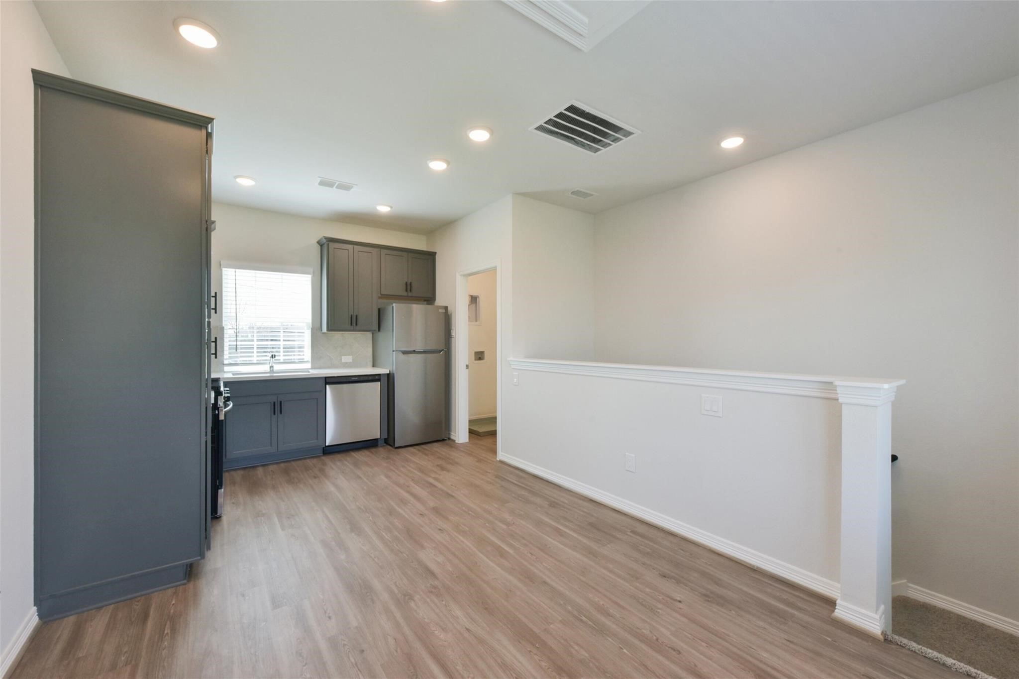 6835 New York Street Houston, TX 77021 - Photo 5 of 12 a view of kitchen with wooden floor