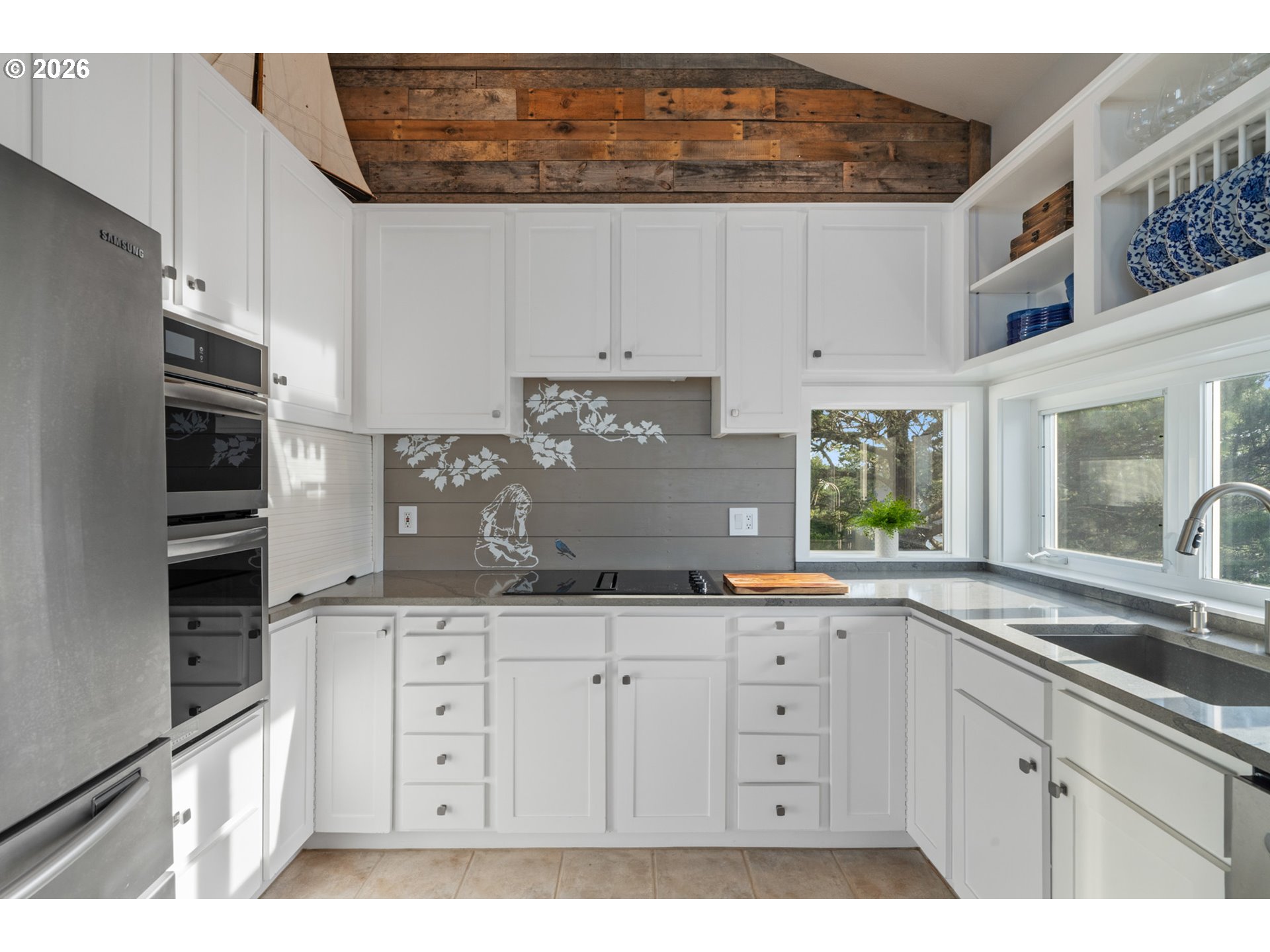 355 Promontory Lane Oceanside, OR 97141 - Photo 12 of 48 a kitchen with granite countertop a sink cabinets and stainless steel appliances