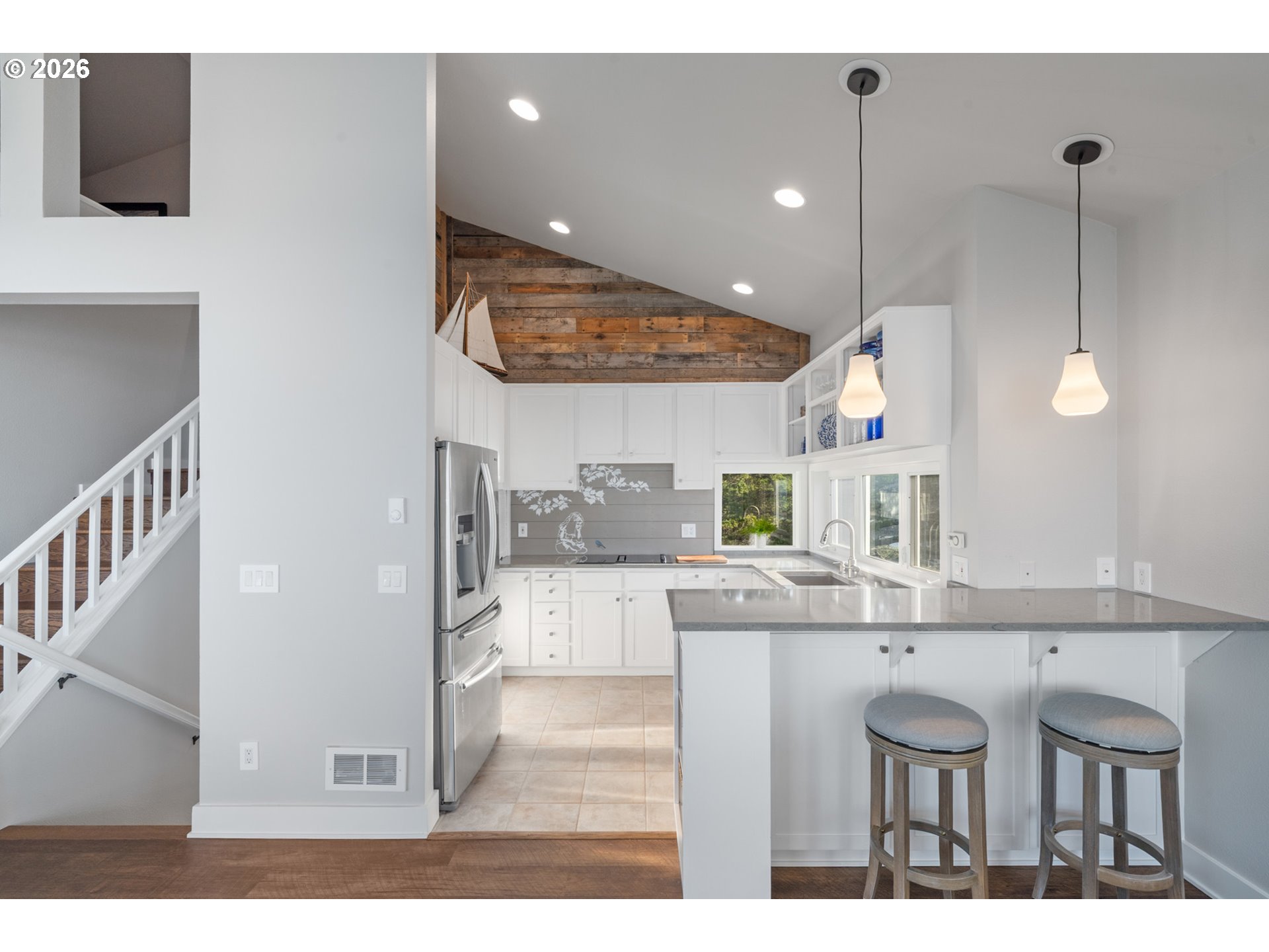 355 Promontory Lane Oceanside, OR 97141 - Photo 13 of 48 a kitchen with kitchen island stainless steel appliances a sink and cabinets