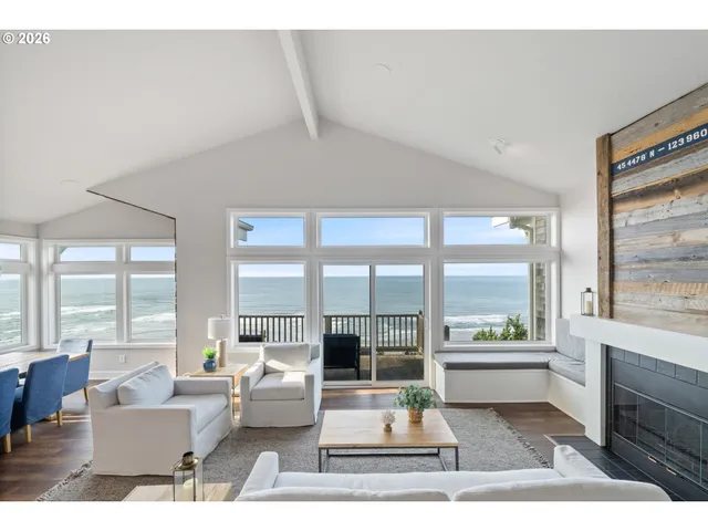 a living room with furniture and large windows