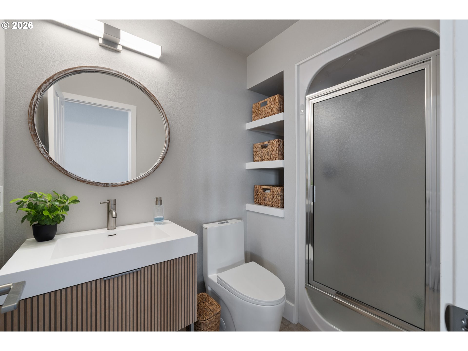 355 Promontory Lane Oceanside, OR 97141 - Photo 18 of 48 a bathroom with a sink mirror vanity and toilet