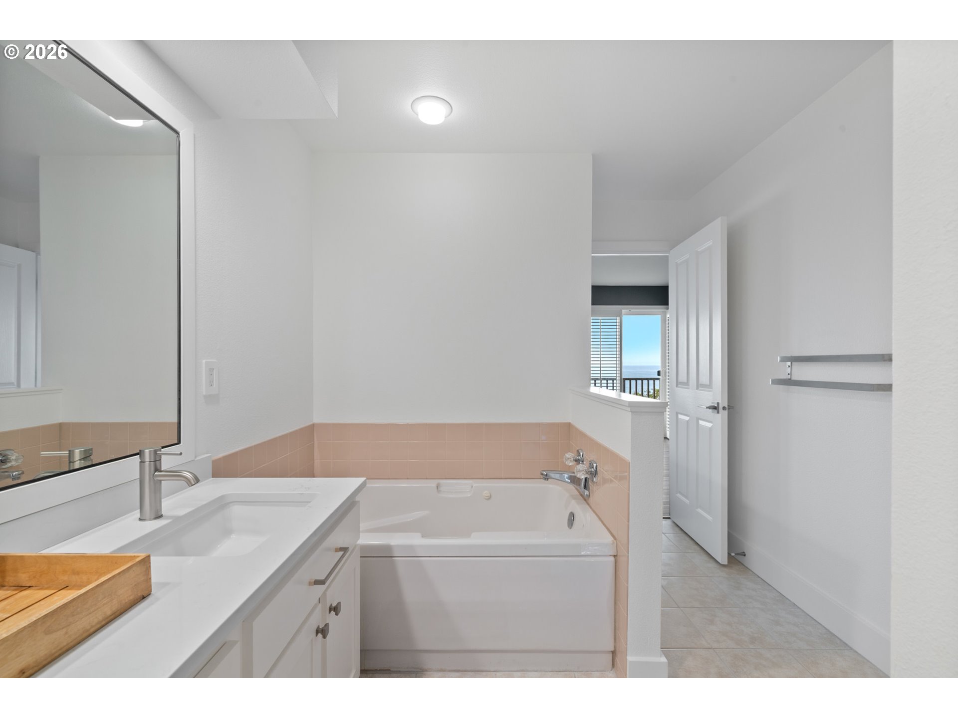 355 Promontory Lane Oceanside, OR 97141 - Photo 29 of 48 a bathroom with a sink and a mirror