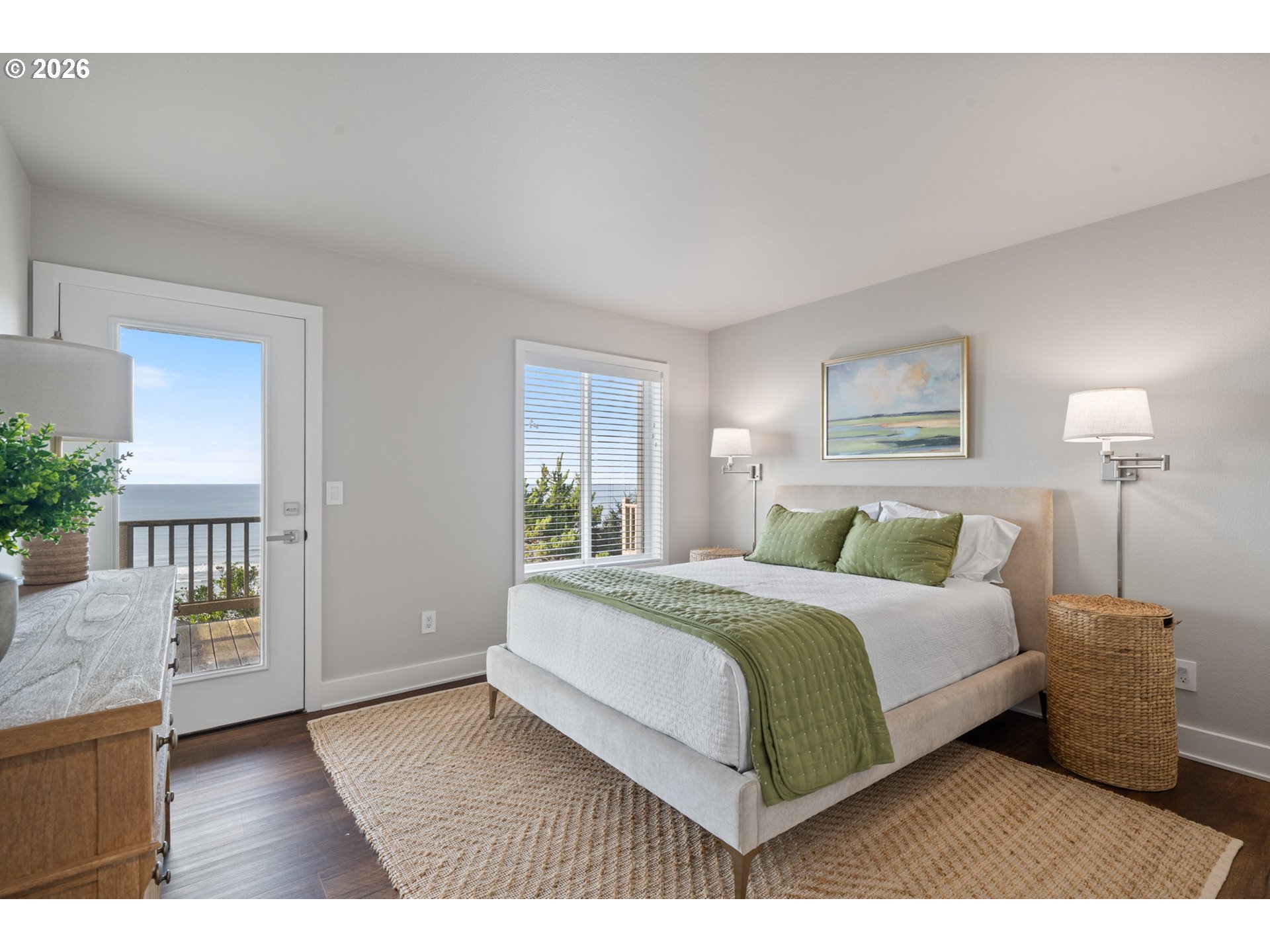 355 Promontory Lane Oceanside, OR 97141 - Photo 30 of 48 a bedroom with a bed a mirror and a window