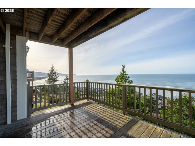 a view of balcony with wooden floor