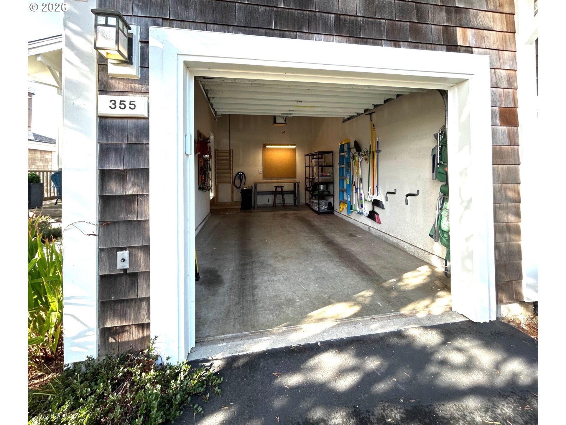 355 Promontory Lane Oceanside, OR 97141 - Photo 37 of 48 a view of a house with potted plants