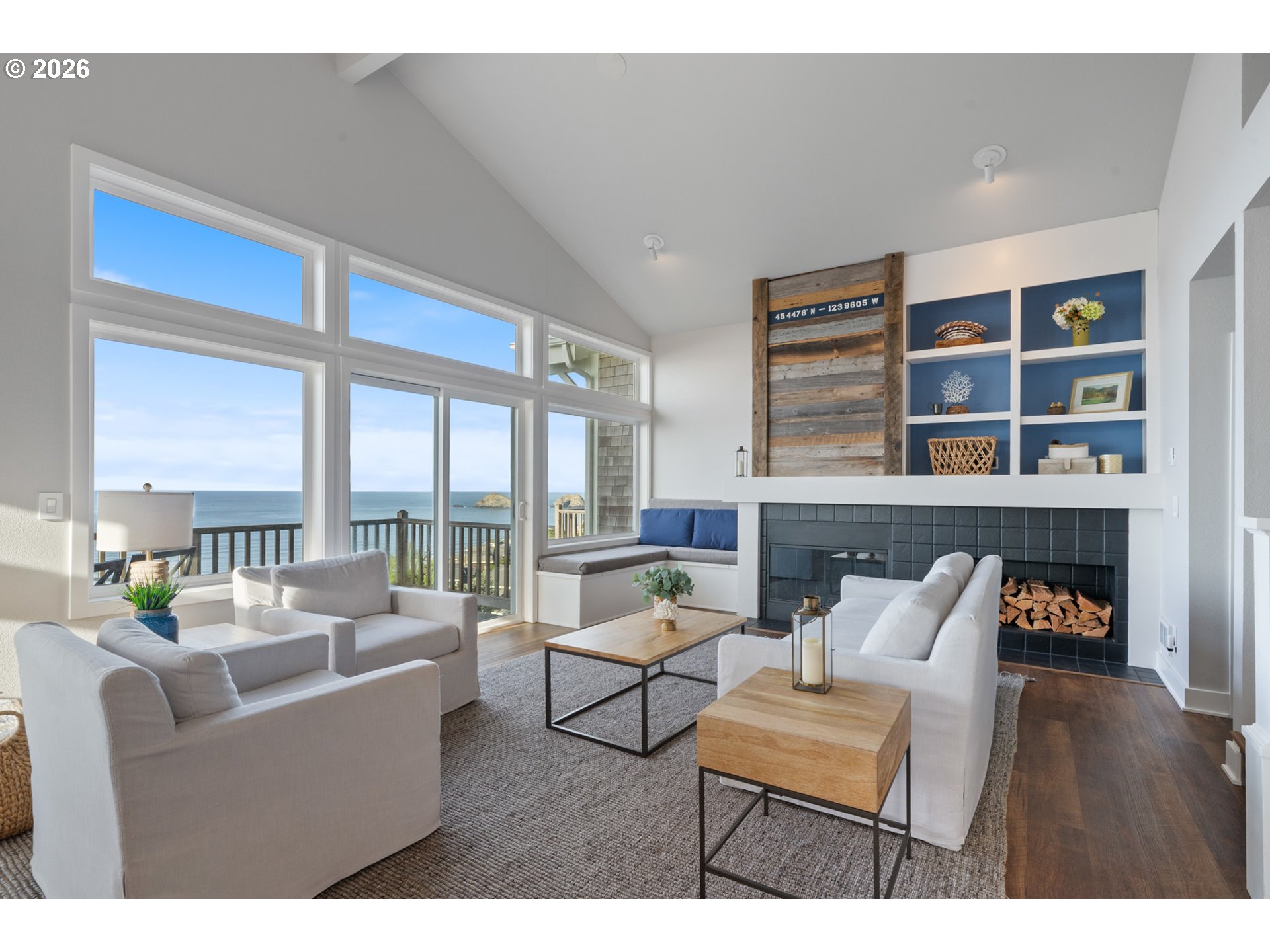 355 Promontory Lane Oceanside, OR 97141 - Photo 4 of 48 a living room with furniture and a floor to ceiling window