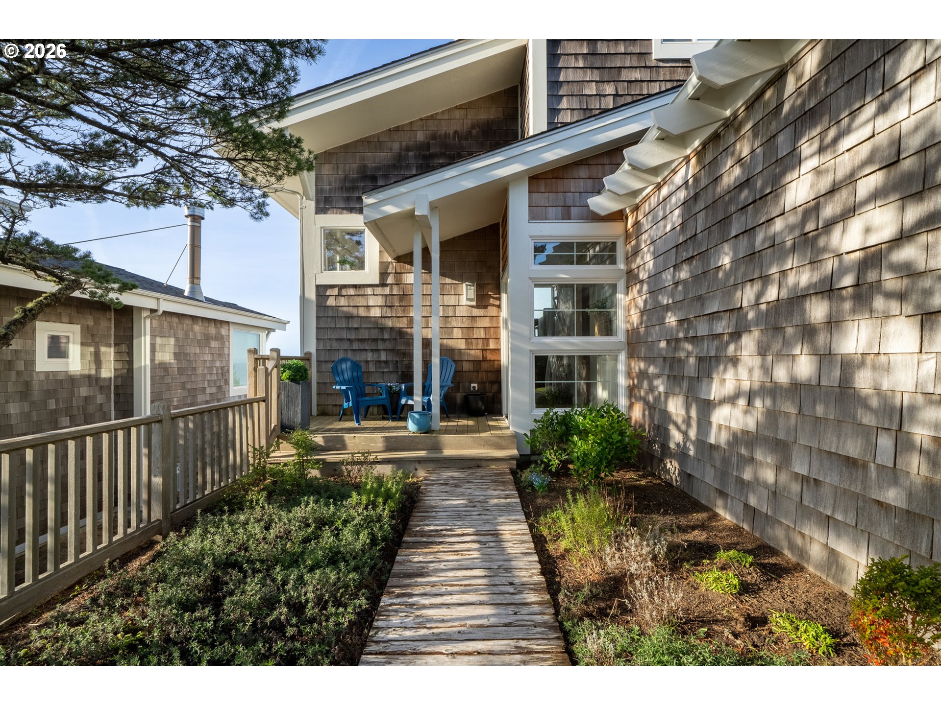 355 Promontory Lane Oceanside, OR 97141 - Photo 42 of 48 a view of a house with brick walls