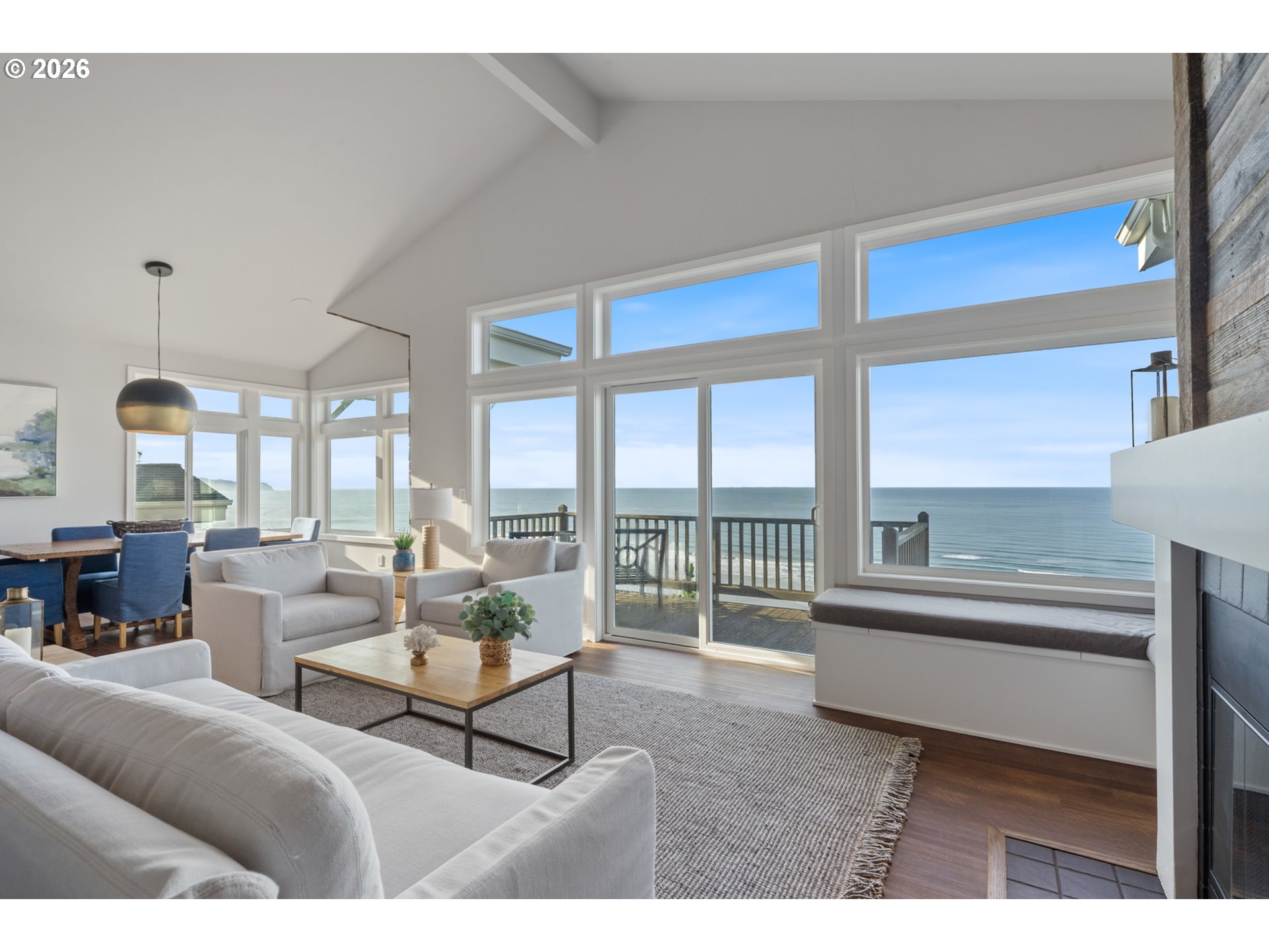 355 Promontory Lane Oceanside, OR 97141 - Photo 5 of 48 a living room with furniture and a floor to ceiling window