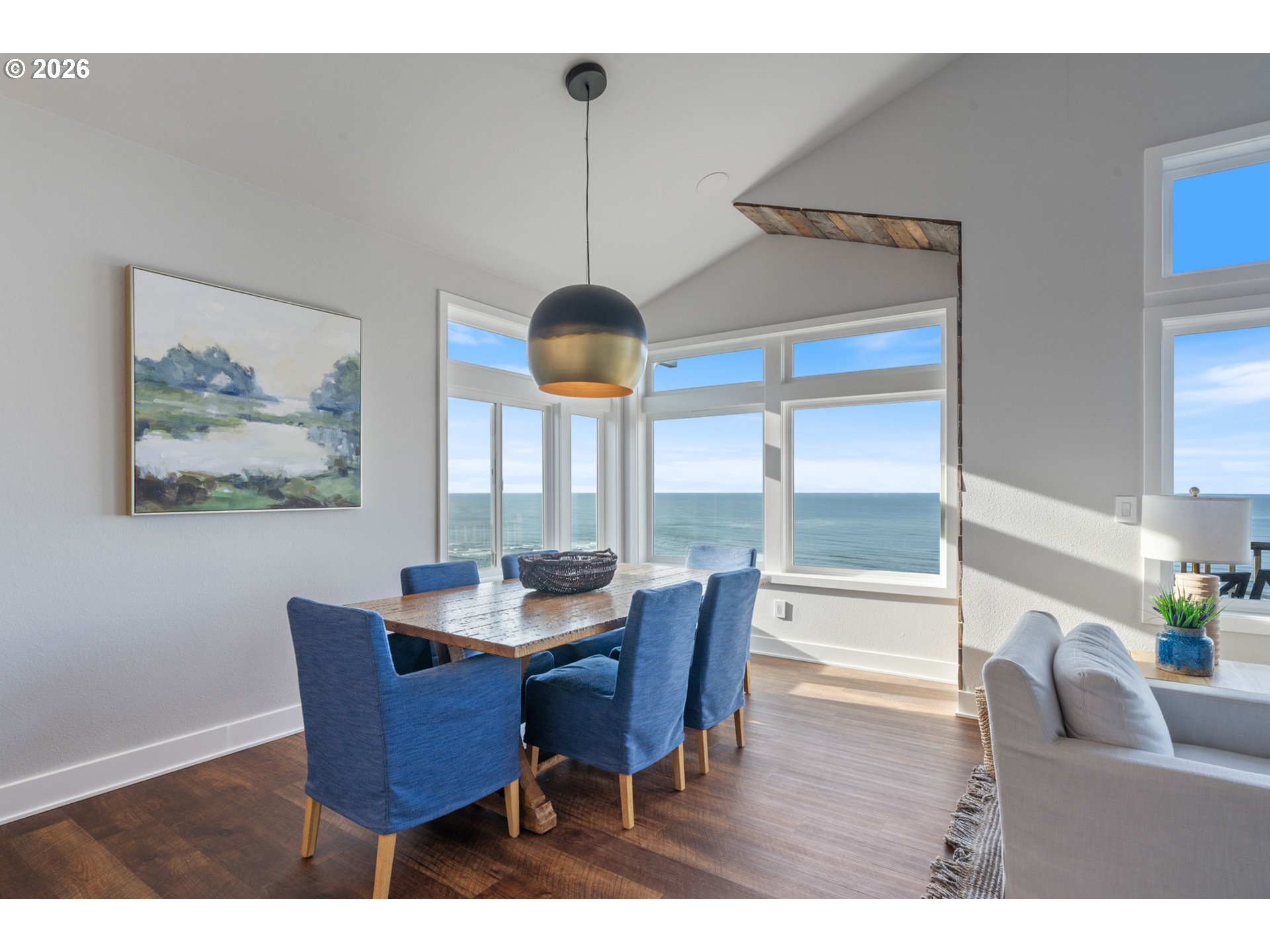 355 Promontory Lane Oceanside, OR 97141 - Photo 7 of 48 a dining room with furniture a chandelier and wooden floor