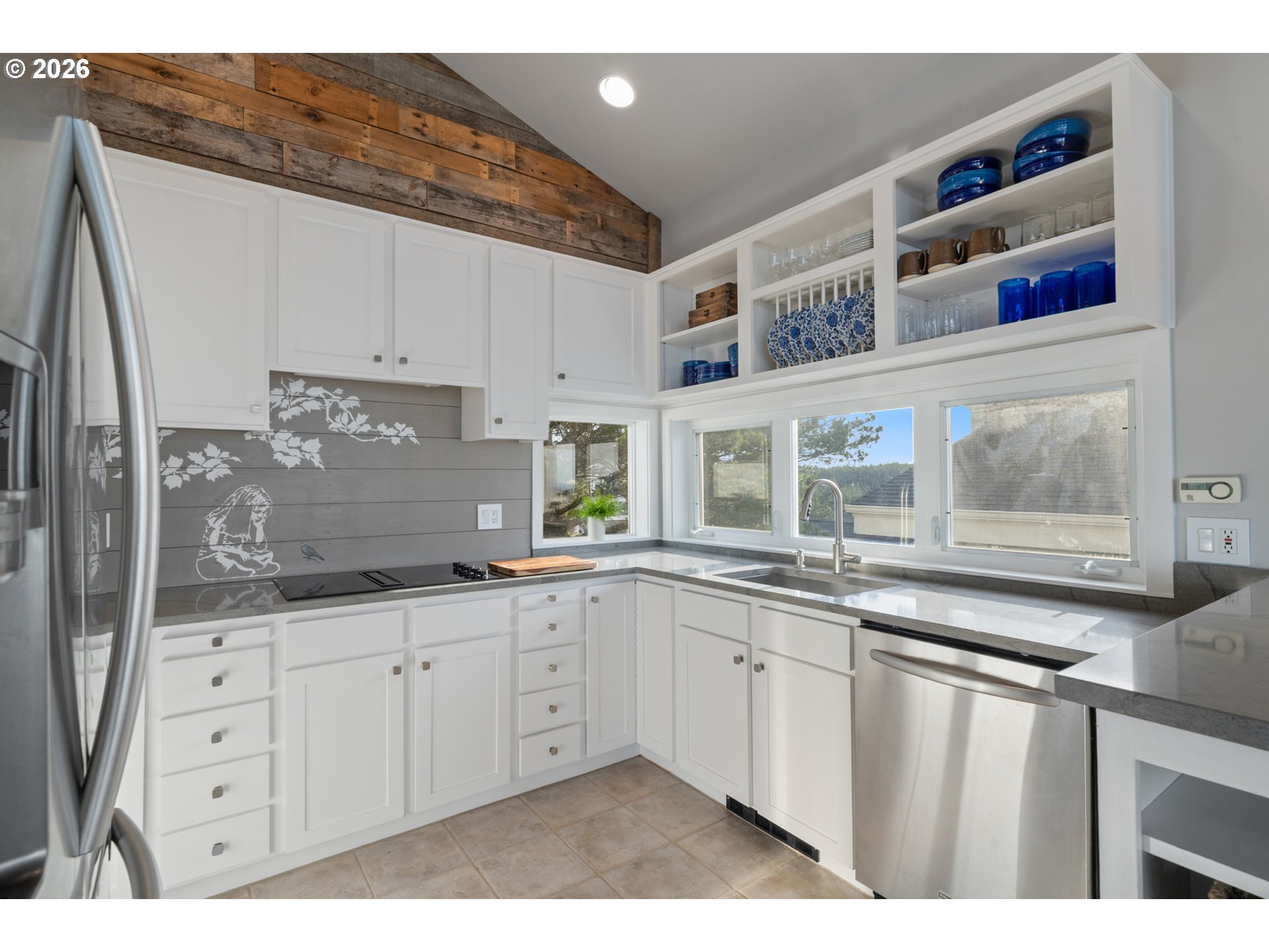 355 Promontory Lane Oceanside, OR 97141 - Photo 10 of 48 a kitchen with granite countertop a sink and cabinets