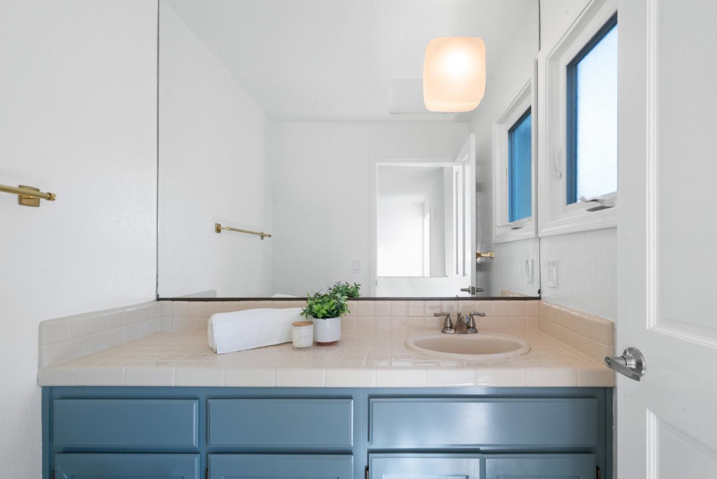 1102 Vía Tornasol Aptos, CA 95003 - Photo 37 of 67 a bathroom with a sink and a mirror