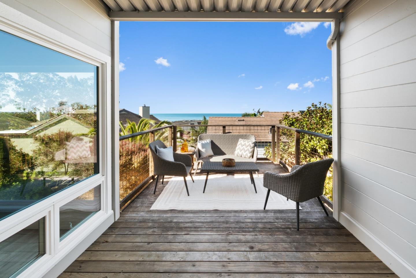 1102 Vía Tornasol Aptos, CA 95003 - Photo 8 of 67 a view of a balcony with chairs and wooden floor